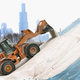 A Streets and Sanitation worker grooms a pile of road salt as the city makes preparations for another winter storm on February 4, 2014 in Chicago, Illinois. Image: Getty